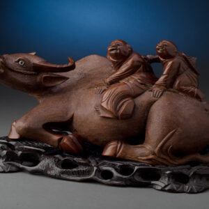 Carved Figures on Water Buffalo